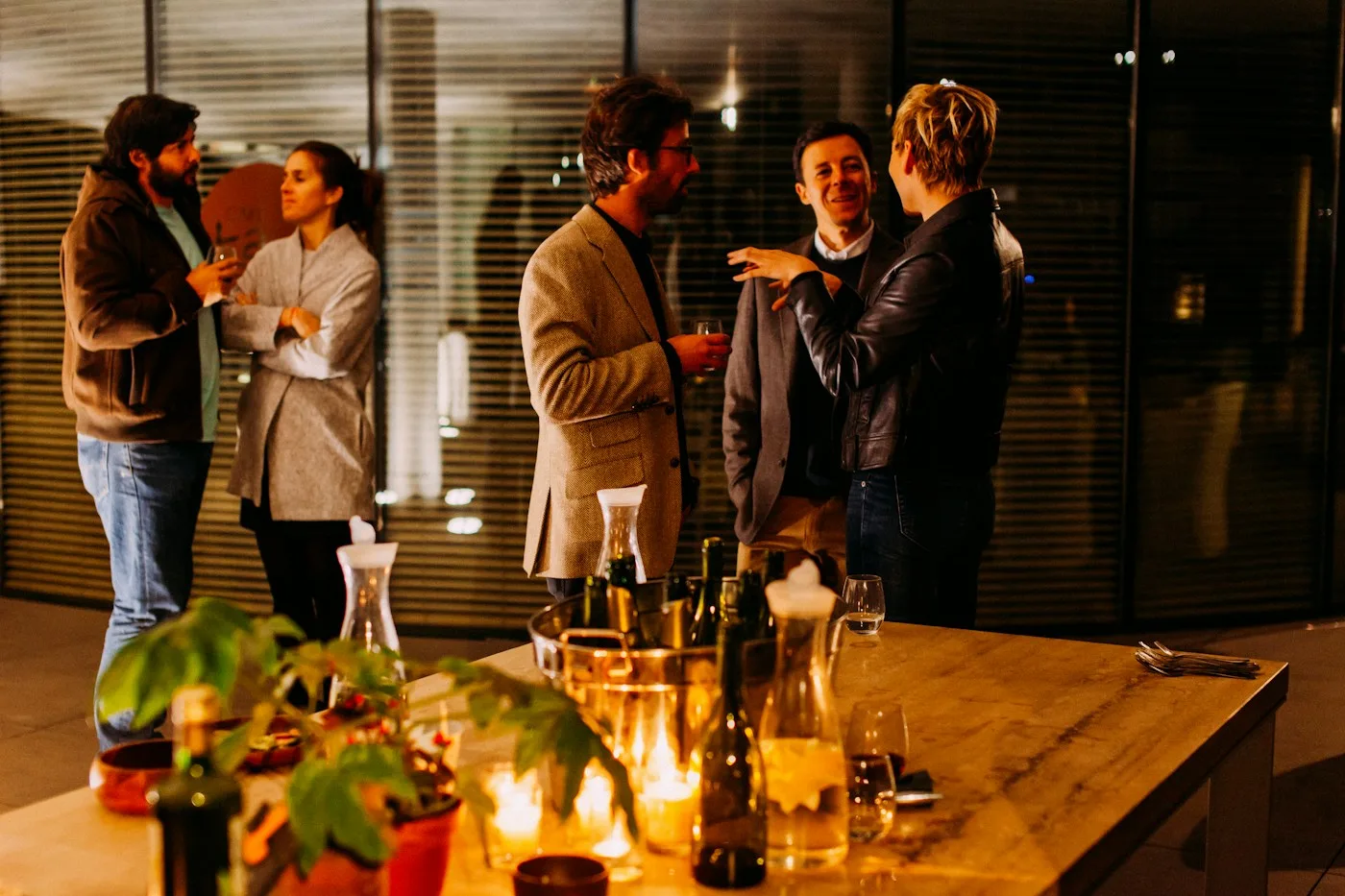 People exchanging ideas at an intimate evening reception